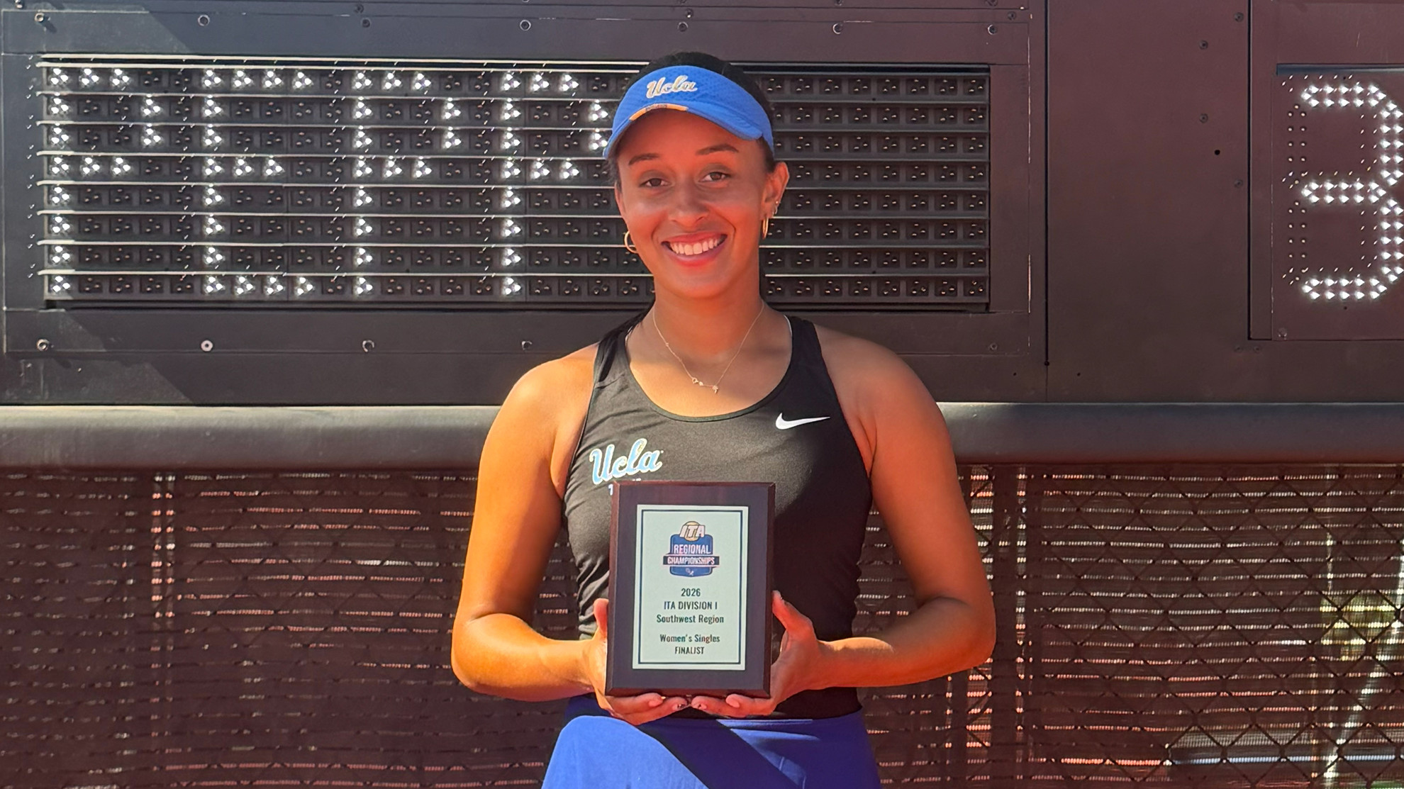 Ahmani Guichard poses with her finalist trophy at ITA Southwest Regionals
