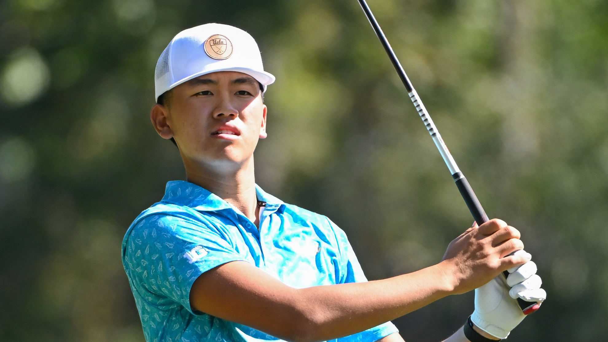 Josh Kim observes a shot on the fairway