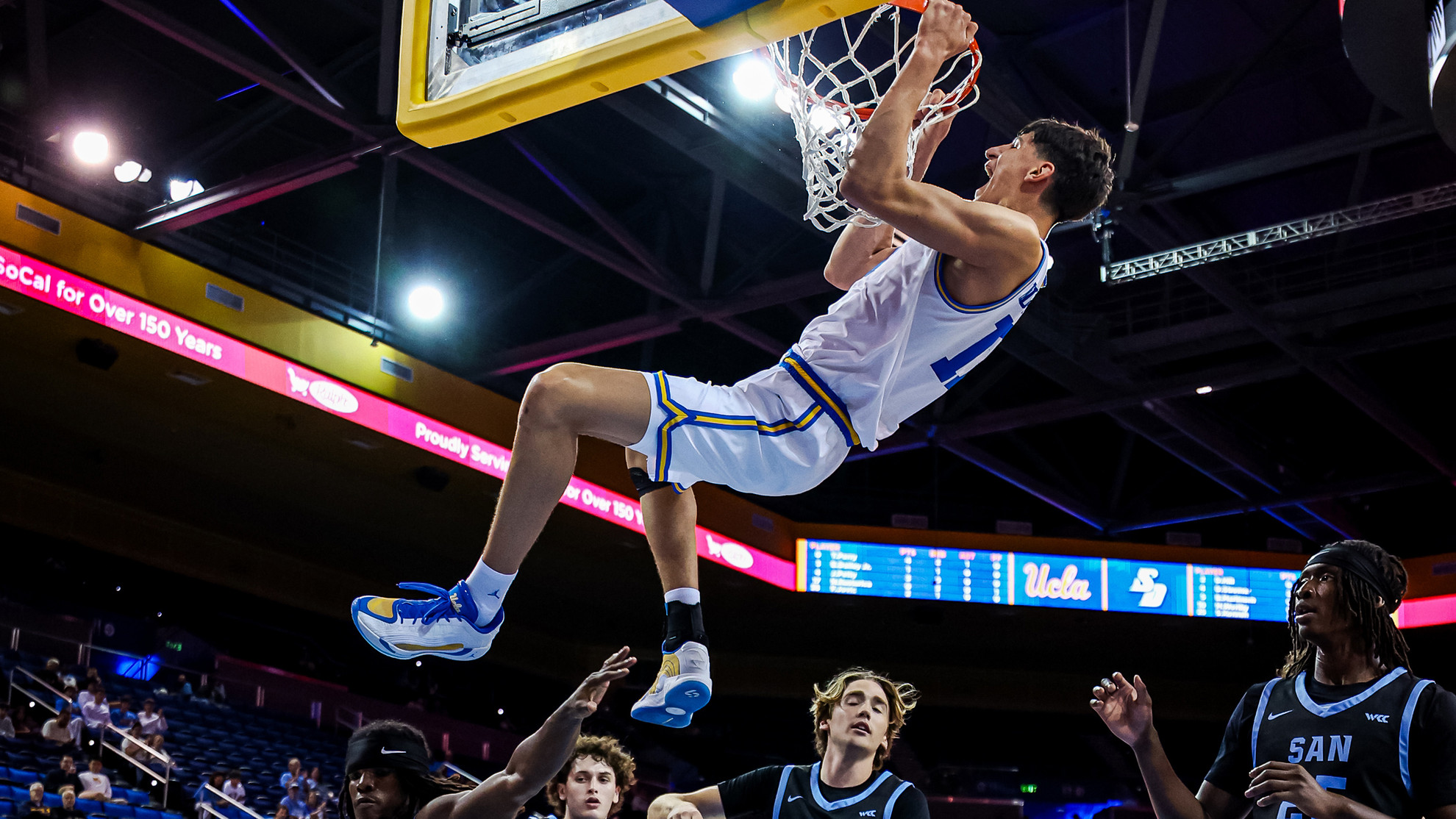 Nikola Kusturica throws down a slam dunk in an exhibition game against San Diego