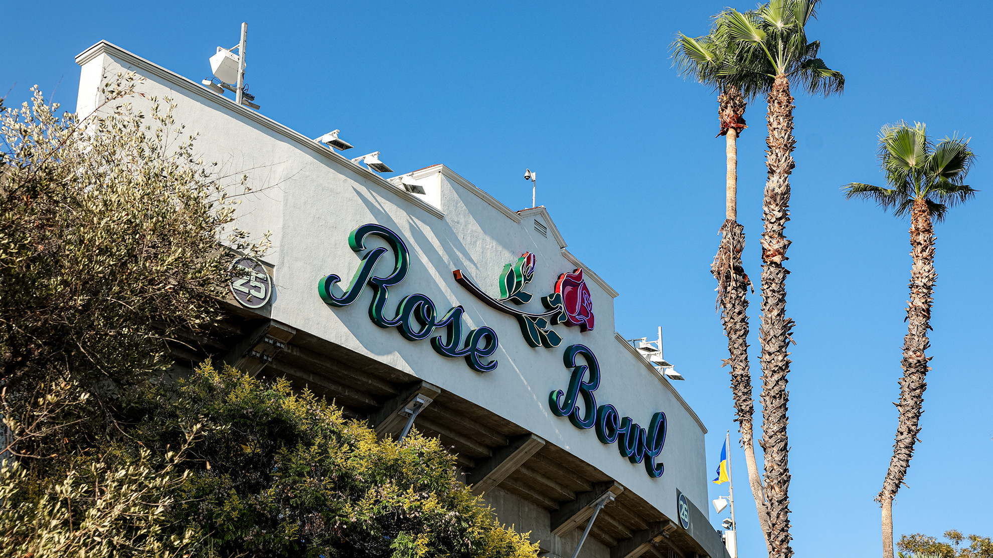 The iconic Rose Bowl marquee is pictured with surrounding palm trees