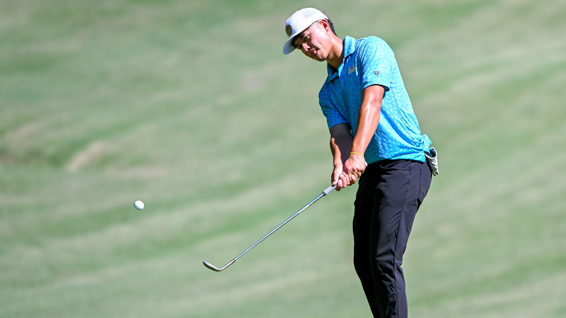 Tyler Loree hits the ball on the fairway at The Golf Club of Georgia