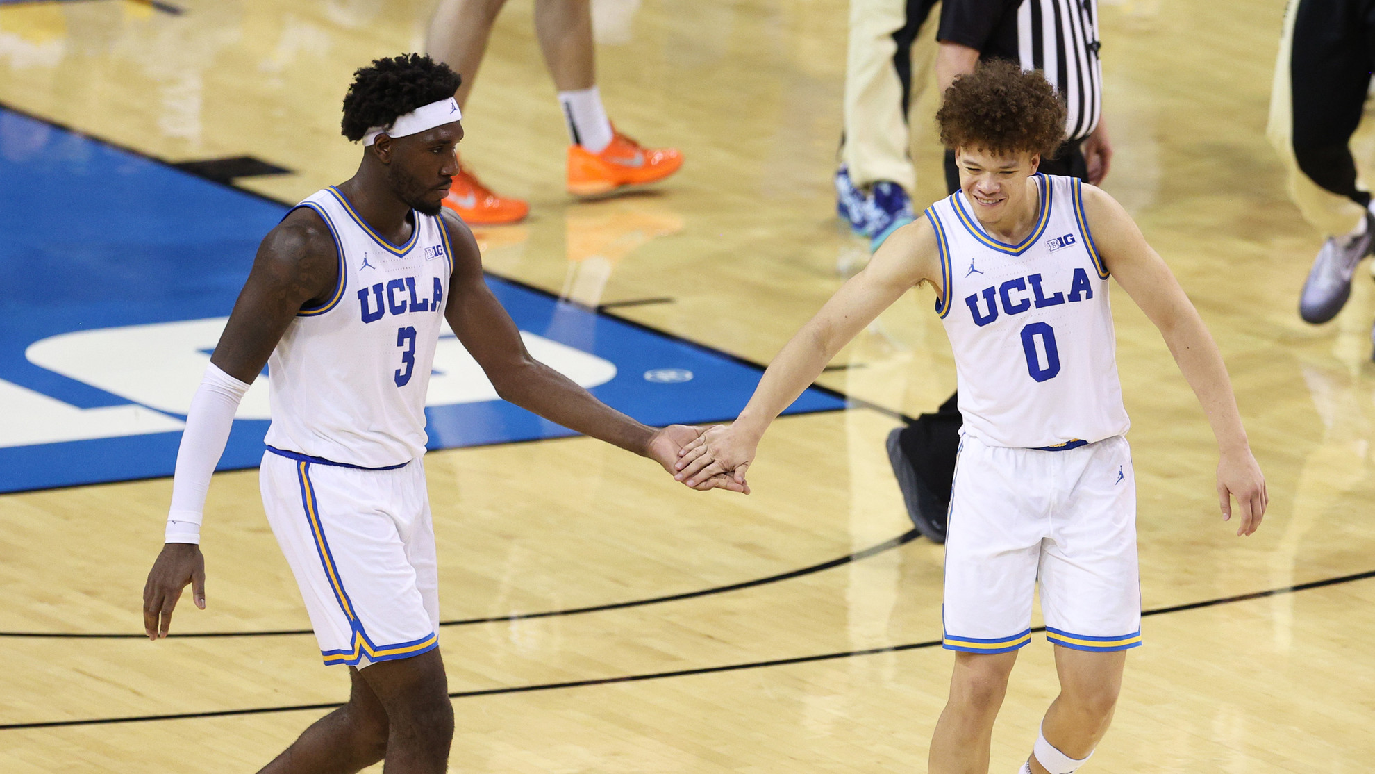 Eric Dailey Jr. gives Trent Perry a high five during a home game in 2026