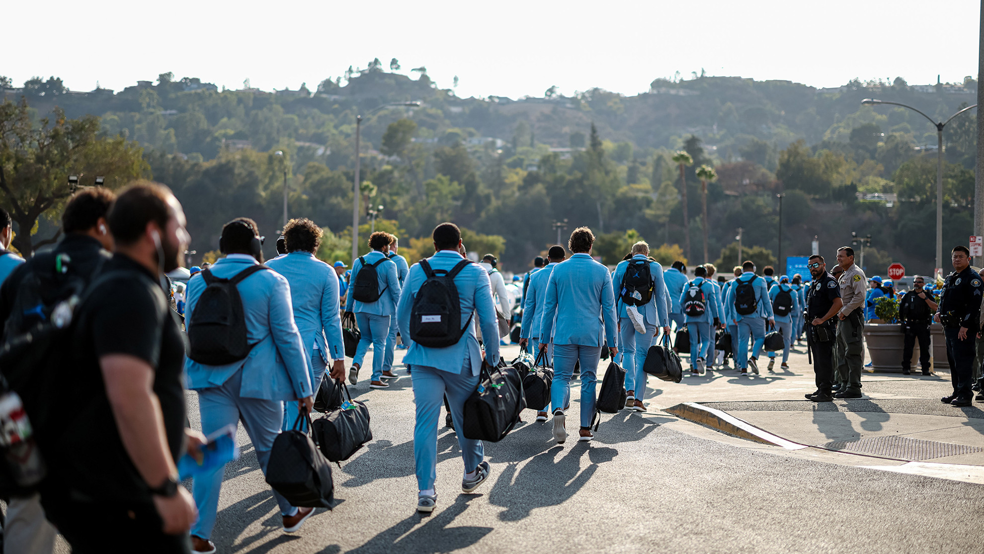 The UCLA Football team participates in Bruin Walk at the Rose Bowl