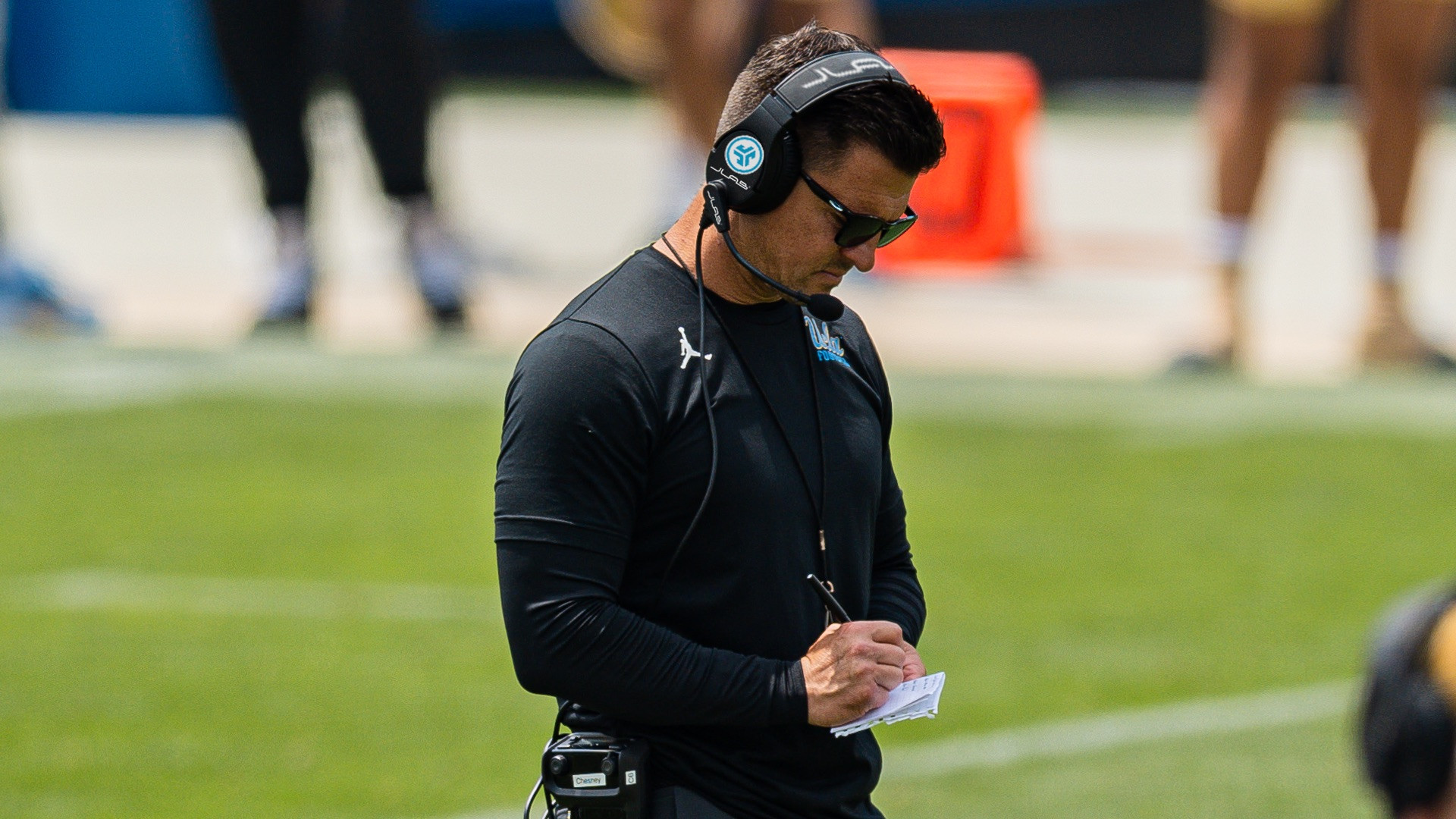 Head coach Bob Chesney with a UCLAxJLab graphic on the photo