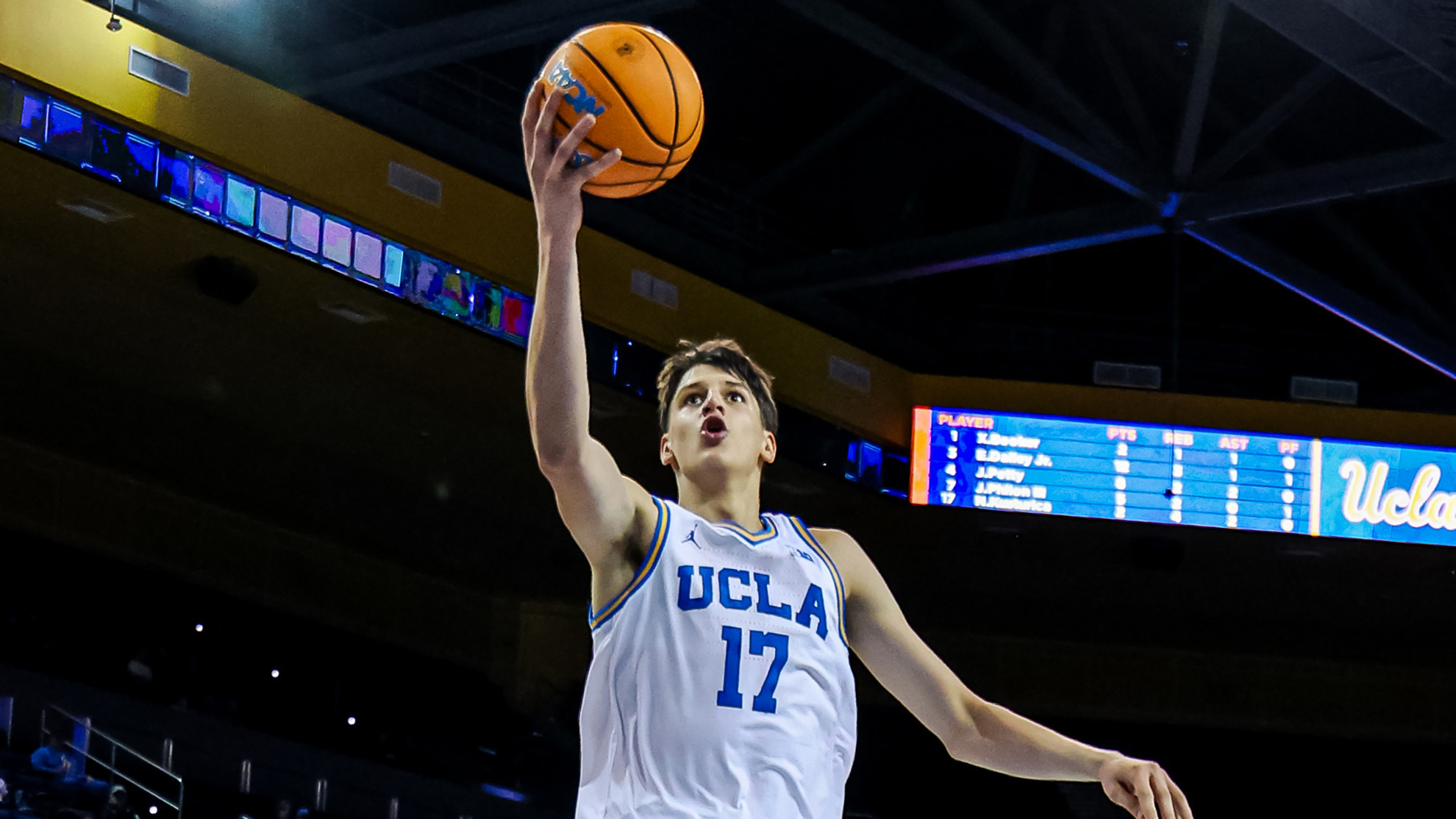 Nikola Kusturica drives to the hoop for a layup in an exhibition game