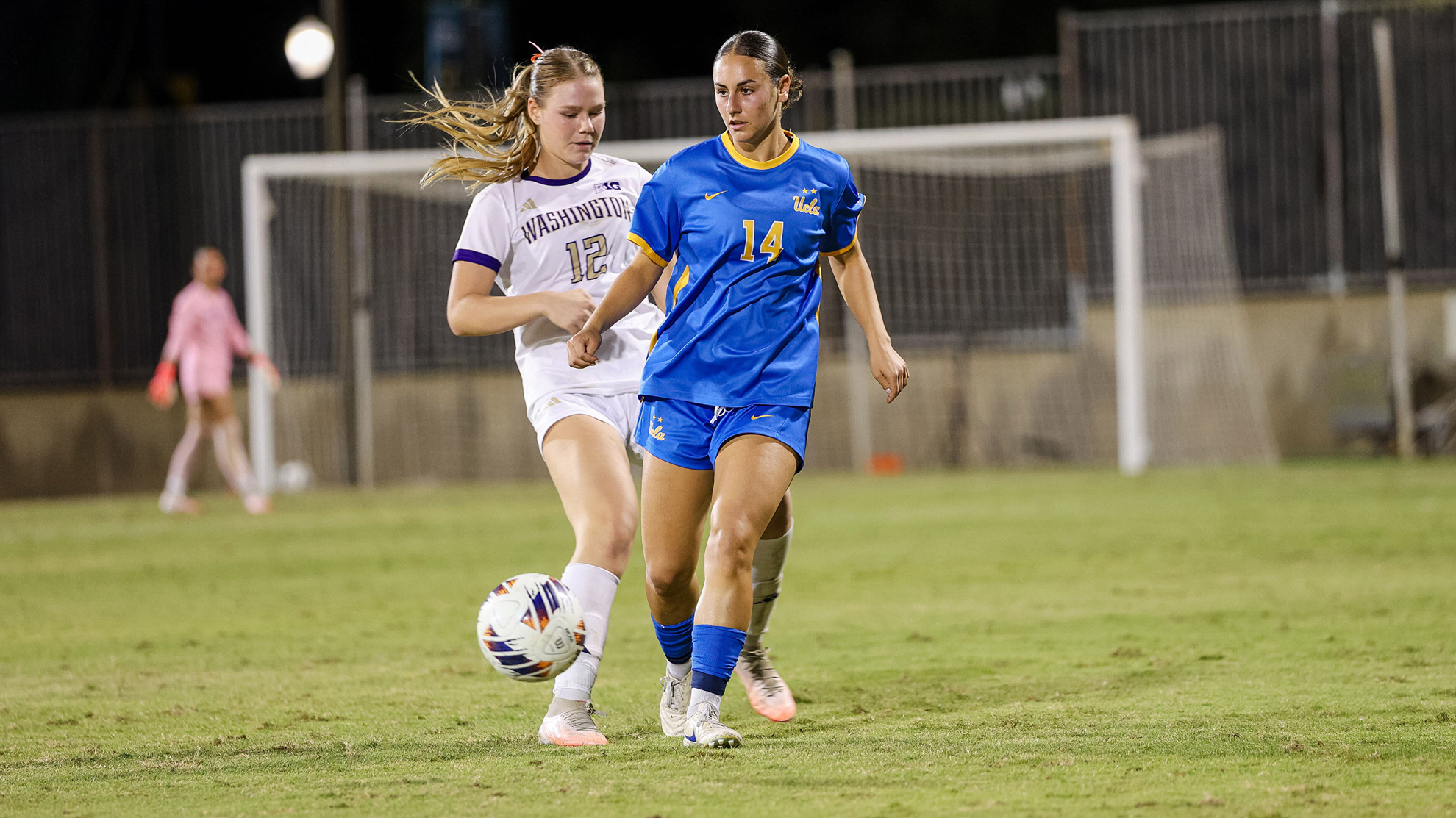 Cate Sarinopoulos keeps the ball away from a defender